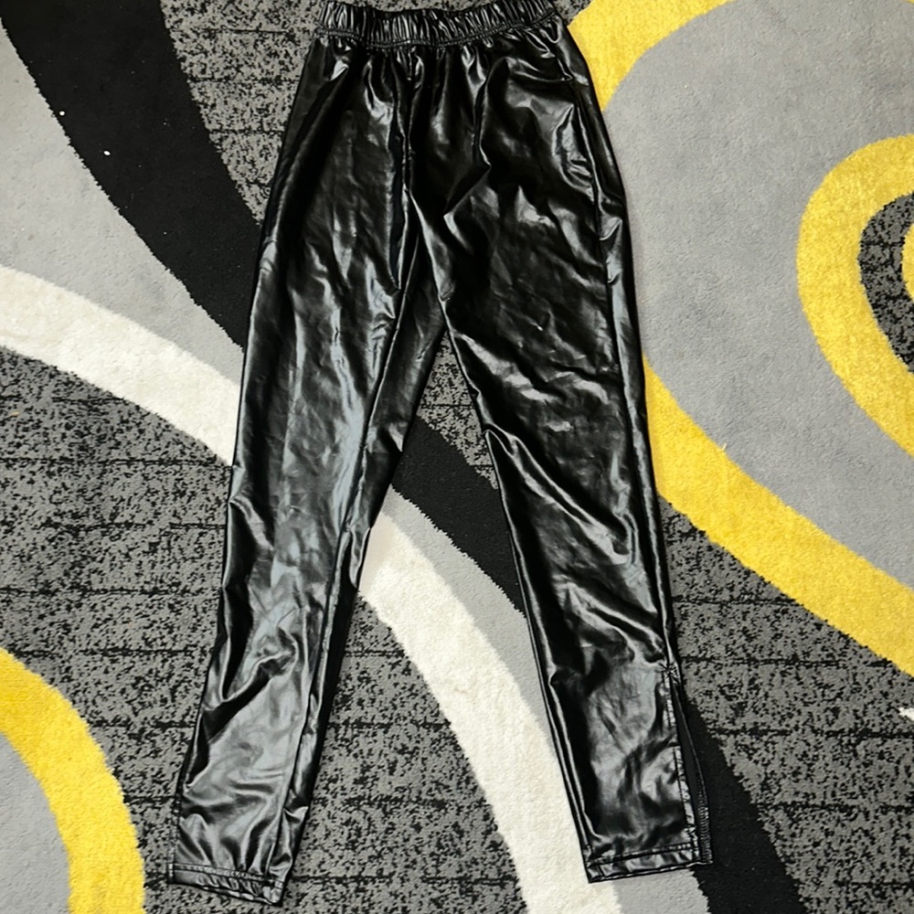 Black fitted leather pants